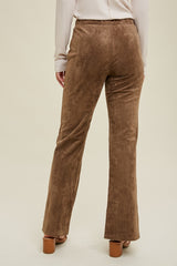 woman wearing brown flared pants with a soft, suede-like texture, view from the back