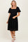 woman wearing a black short sleeve lace dress with a square neckline and a flared skirt