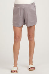 woman wearing grey maternity shorts with an elastic waistband and casual fit