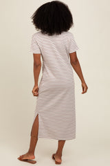 woman wearing a brown and white striped short sleeve maxi dress with side slits, seen from the back