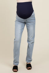 woman wearing a pair of light blue maternity jeans with a navy blue over-the-bump waistband
