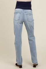 woman wearing light blue maternity jeans with a fitted waistband, viewed from the back