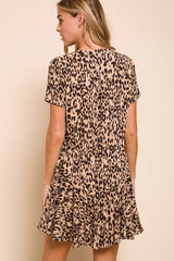 woman wearing a short-sleeve beige leopard print dress with a flared skirt and a relaxed fit