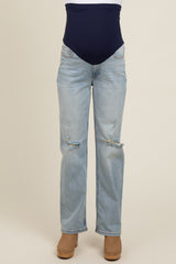 maternity wear light blue distressed jeans with a navy blue belly support panel worn by a model