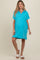 woman wearing a bright blue maternity polo dress with short sleeves and a relaxed fit, showing her baby bump
