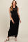 woman wearing a black ribbed maternity maxi dress with sleeveless design and a visible baby bump