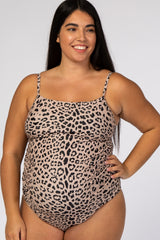 woman wearing a leopard print maternity swimsuit with adjustable straps and a visible baby bump