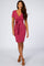 woman wearing a pink short sleeve bodycon dress with a front tie detail and a deep v-neckline