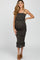 pregnant woman in black and tan speckled tiered maternity midi dress with spaghetti straps