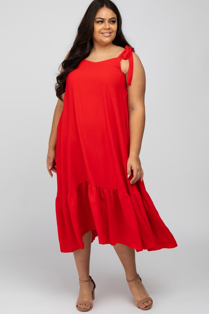 woman wearing a red plus-size maxi dress with a ruffled hem and tie shoulder details