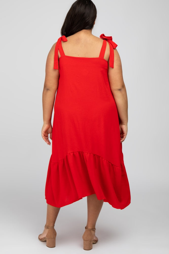 plus size woman wearing a red sleeveless dress with tie straps and a ruffled hem, shown from the back