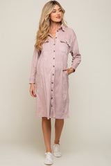 Woman wearing a mauve corduroy maternity shirt dress with buttons and pockets