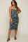woman wearing a colorful floral print ruched maternity midi dress with a halter neckline