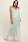 woman wearing a mint green maternity maxi dress with lace detailing and tie straps, showing her baby bump